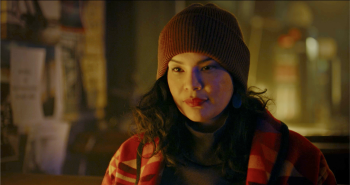 A young woman wearing a red toque and winter jacket is seen in the film Redlights.