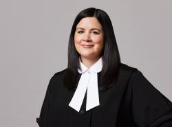 This is a photo of a woman in a black Supreme Court of Canada robe and white collar.